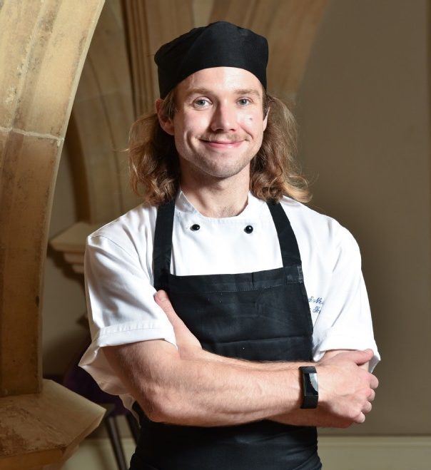 Chef posing for photo in historic venue